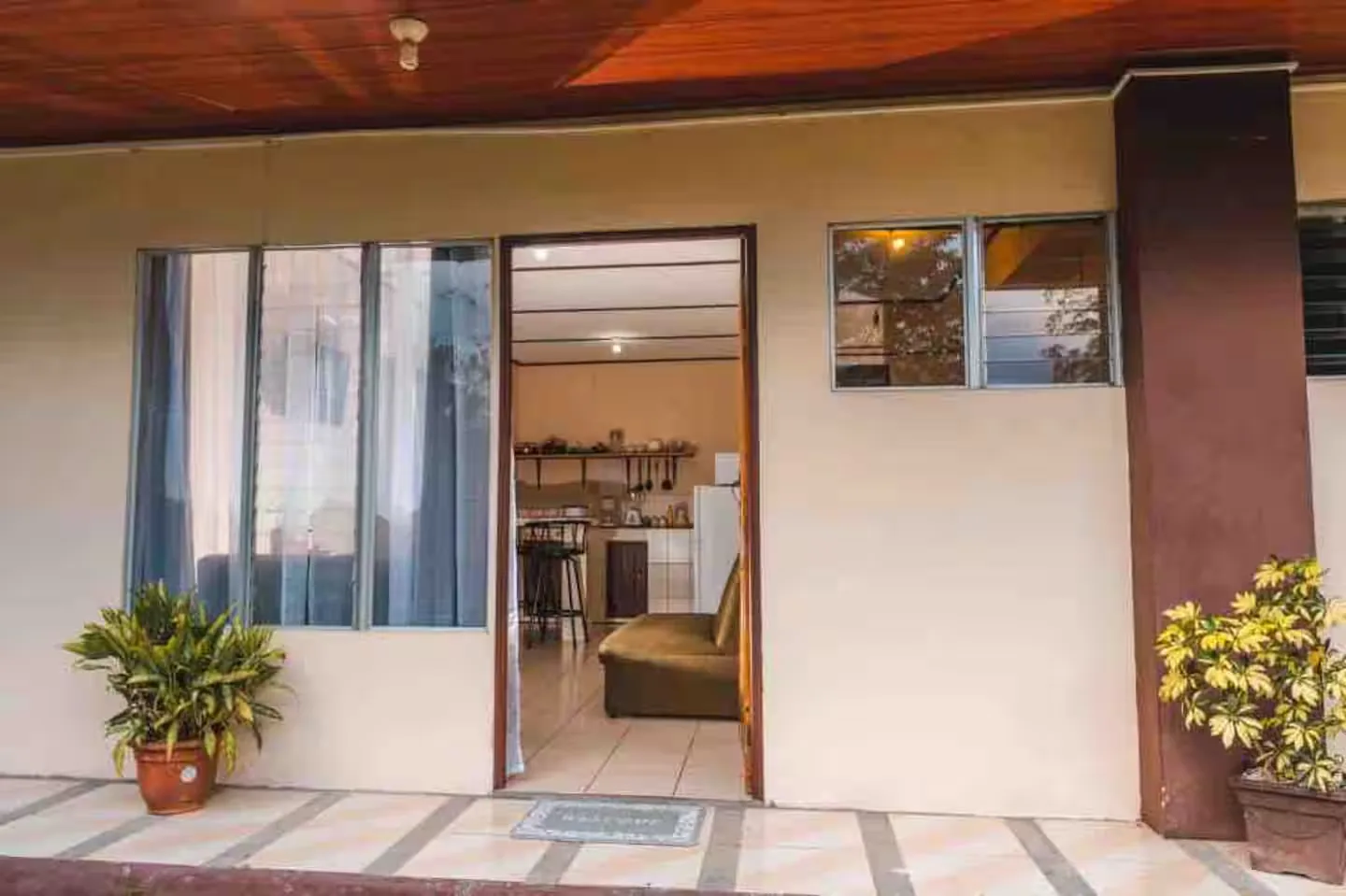 Covered terrace with the sliding doors open onto the kitchen and living room