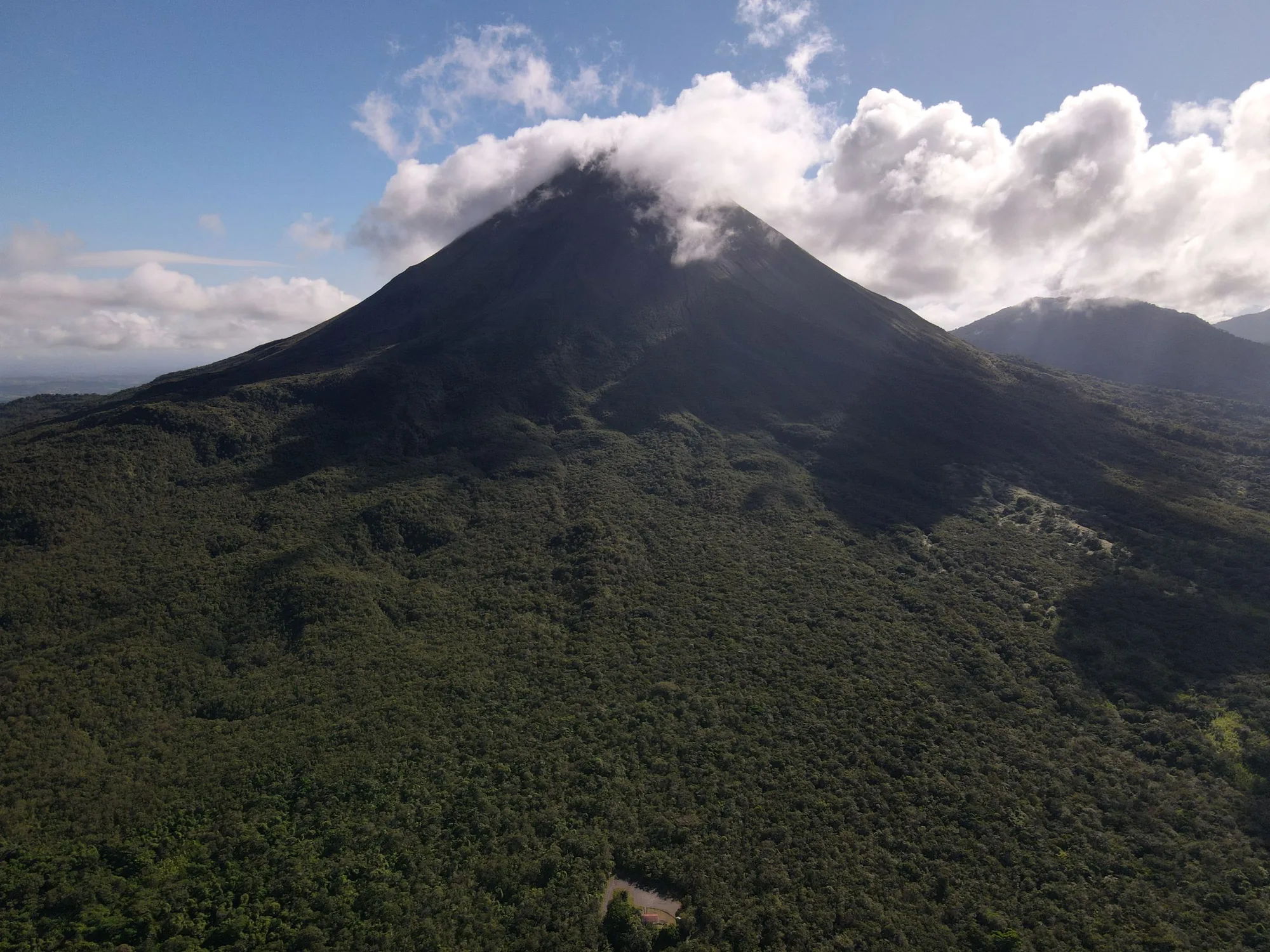 The dark cone with cloud pouring off the summit