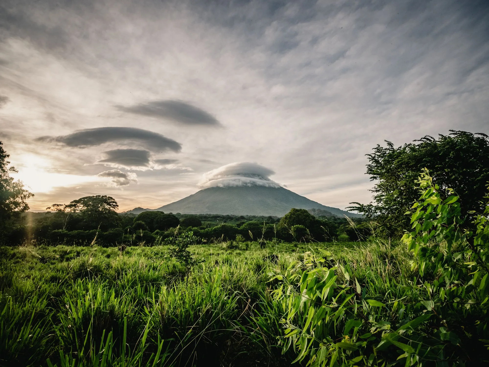 The cone at dusk under a lens-shaped cloud